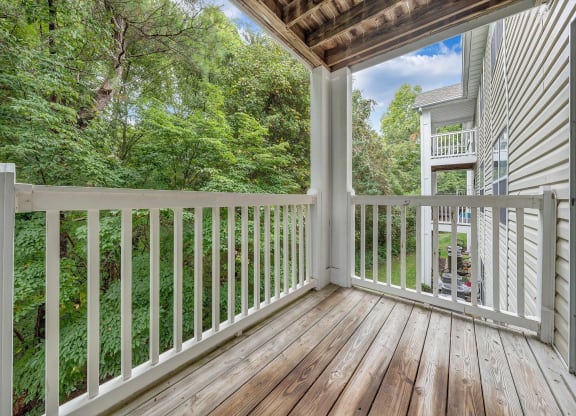 a balcony with a woodland view at The Vinings Apartments, Richmond, Virginia