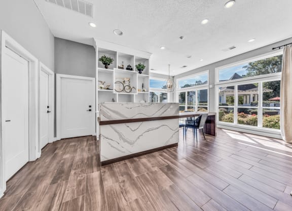 a kitchen with a marble counter top and a large window at Trophy Club at Bellgrade, Midlothian, VA, 23113