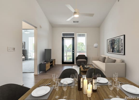 a dining area with a wooden table and chairs and a living room with a couch and a  at Uptown Square Apartments, Michigan, 48083