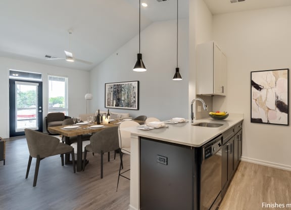 a kitchen and dining area in a 555 waverly unit  at Uptown Square Apartments, Troy, MI