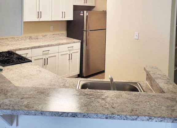 renovated kitchen with stainless steel appliances at Emerald Park Apartments in Kalamazoo, Michigan