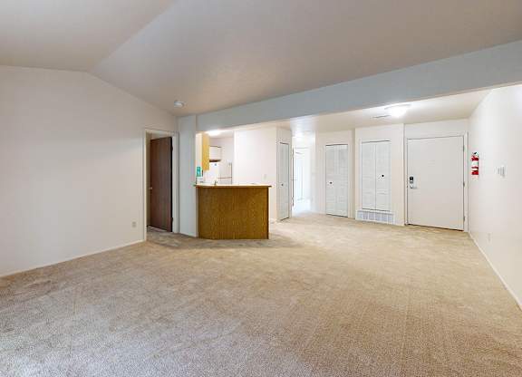 A large living room with a high ceiling at Emerald Park Apartments, Michigan