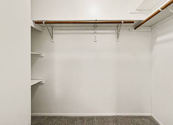 A walk-in  closet with shelving at Emerald Park Apartments, Kalamazoo, Michigan
