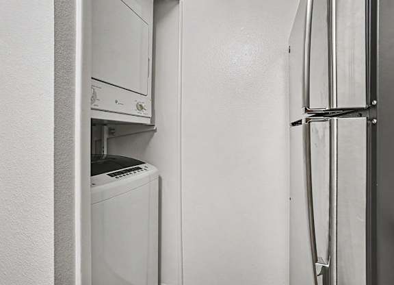 A washer and dryer in a kitchen at Emerald Park Apartments, Kalamazoo, Michigan
