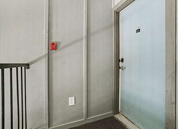 A stairway to an apartment entry door at Emerald Park Apartments in Kalamazoo, MI
