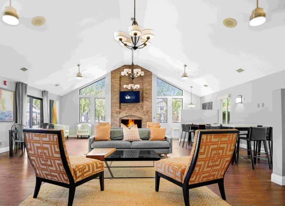 a living room with a couch and chairs and a fireplace at Bay Pointe Apartments, Lafayette, IN, 47909