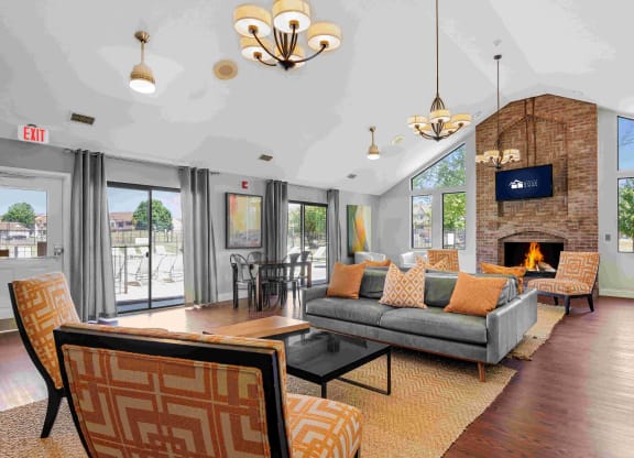 a living room with couches and chairs and a fireplace at Bay Pointe Apartments, Lafayette, IN, 47909