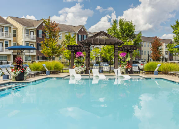 our apartments offer a swimming pool with a gazebo and umbrellas at The Avenue at Polaris Apartments, Columbus, OH