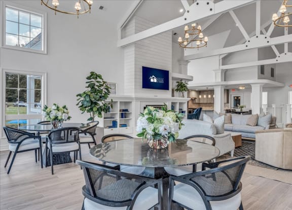 a large living room with a table and chairs at The Vinings Apartments in Richmond, VA