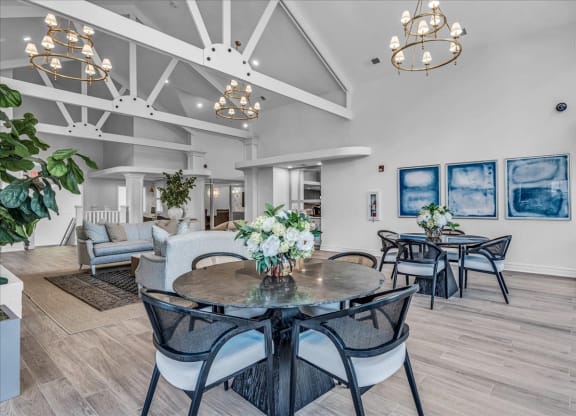 a dining room with a table and chairs at The Vinings Apartments in Richmond, VA