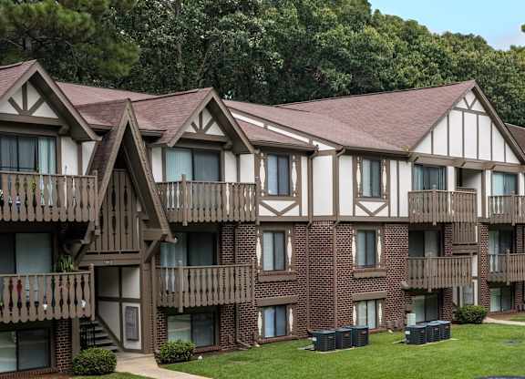 Apartment building with brown brick and white walls at Lake in the Pines, North Carolina, 28311