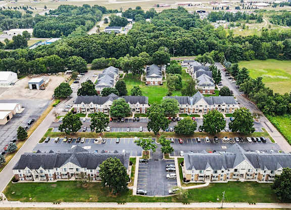 Aerial view of townhome community with parking lots at Fairlane Apartments, Springfield, 49037