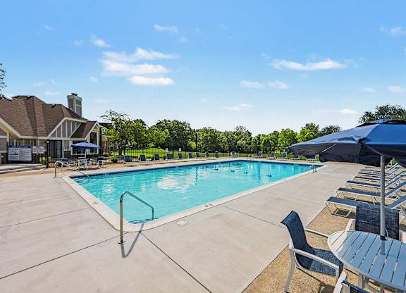 Swimming Pool Area at Fairlane Apartments, Springfield, MI 49037