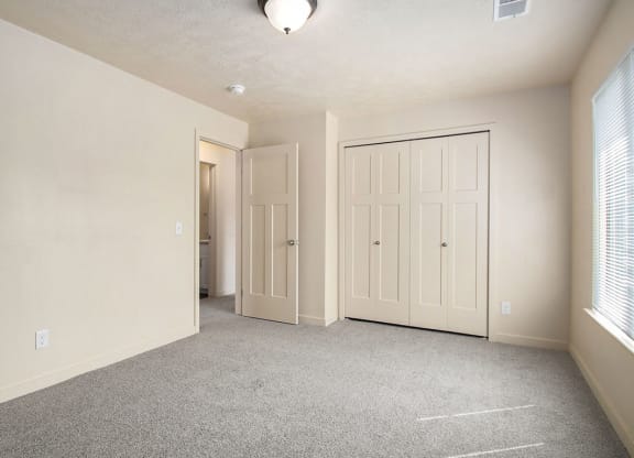 upgraded bedroom has plenty of closet space at Old Farm Apartments, Elkhart, Indiana