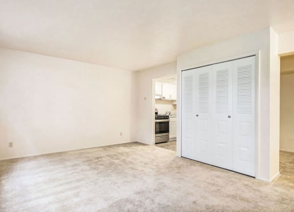 studio living room with plush carpeting at Old Farm Apartments, Elkhart, Indiana