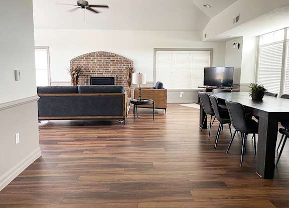 A community room with a brick fireplace at Fieldstream Apartment Homes in Ankeny, IA