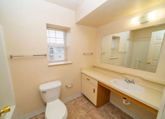 End bathroom with a window at Foxwood and The Hermitage, Portage, MI