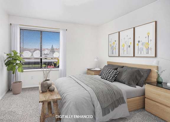 A bedroom with a bed, nightstand, and window at Foxwood and The Hermitage, Michigan