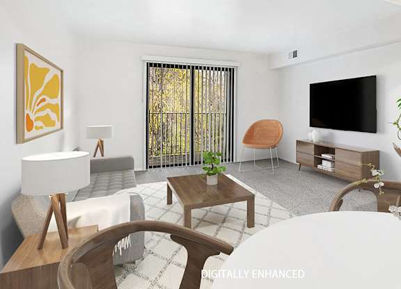 A modern living room with a grey sofa, a wooden coffee table, and a slider to a balcony at Foxwood and The Hermitage, Michigan
