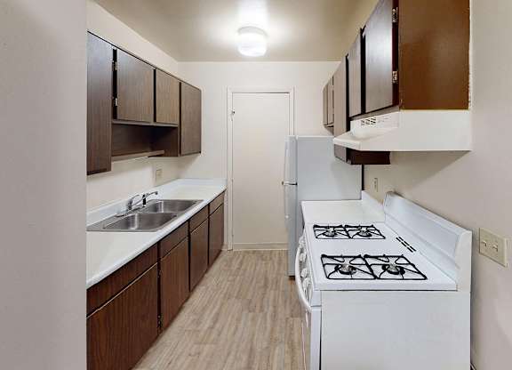A kitchen with a gas stove at Glen Oaks Apartments, Michigan, 49442