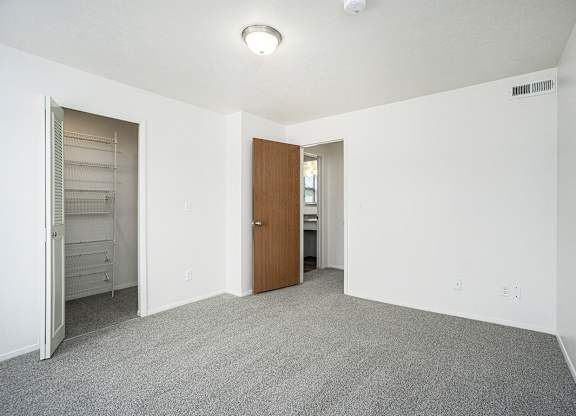 Bedroom with a door to a walk-in closet at Glenn Valley Apartments, Michigan, 49015