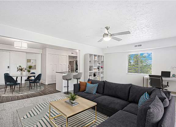An enlarged living room with a couch and a coffee table at Green Ridge Apartments, Grand Rapids, MI