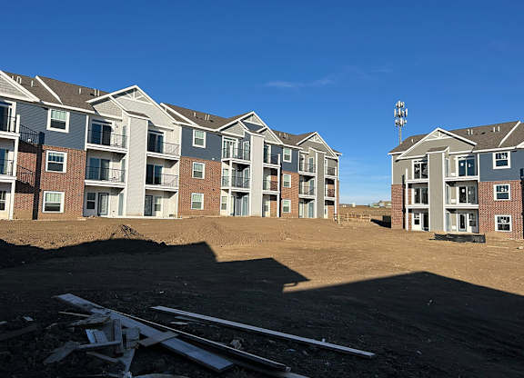 A exterior rear view of new apartment buildings are under construction at The Grove Apartment Homes, Nebraska