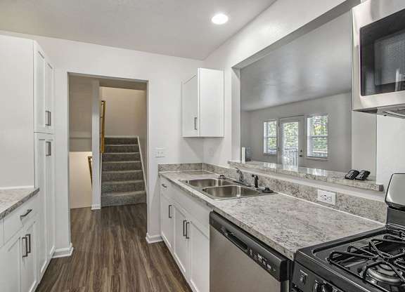Kitchen with hard surface flooring at Gull Prairie/Gull Run Apartments and Townhomes, Kalamazoo