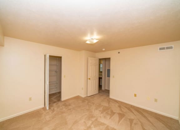 Bedroom with a door to a walk-in closet at Glenn Valley Apartments, Michigan, 49015