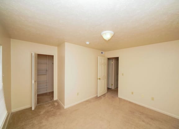 Bedroom with a closet with wardrobe organizers at Glenn Valley Apartments, Battle Creek, MI