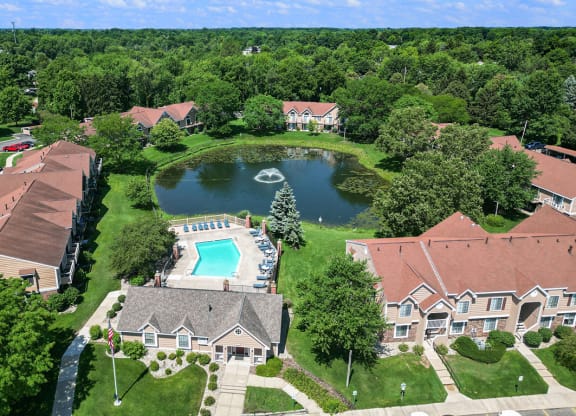 an aerial view of Hampton Lakes neighborhood with a swimming pool and a pond, Walker, MI