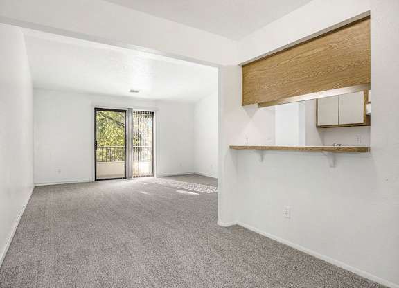 dining and living rooms with carpet at Hampton Lakes Apartments, Michigan, 49534