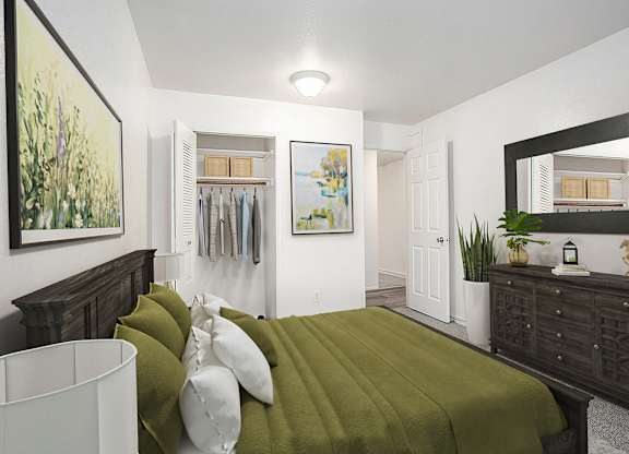 A bedroom with a closet, bed and a wooden dresser at Hampton Lakes Apartments, Michigan, 49534
