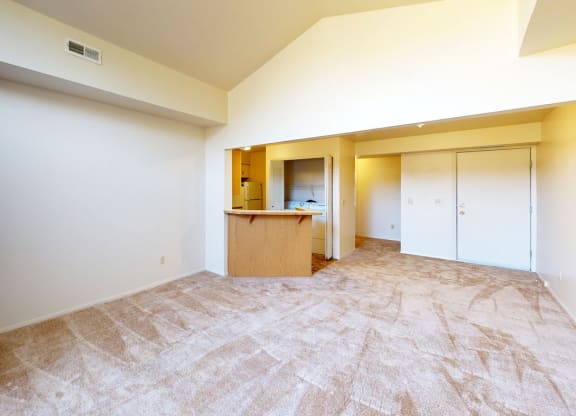 a spacious living room and kitchen with a high ceiling at Hurwich Farms Apartments, Indiana