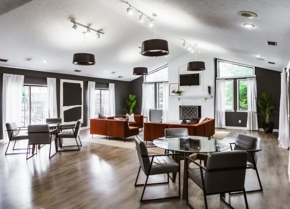 a dining room and living room with a table and chairs