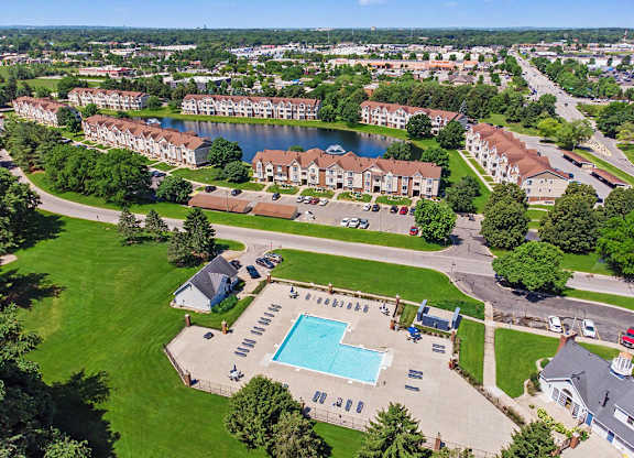 A large apartment complex with a swimming pool in the foreground at Indian Lakes Apartments, Mishawaka, Indiana