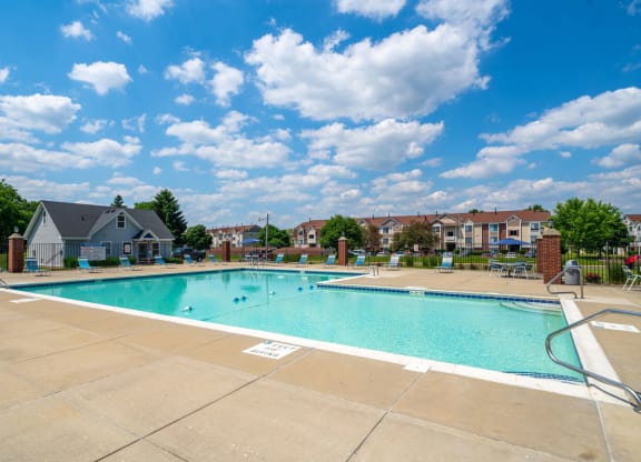 Outdoor Swimming Pool with Lounge Chairs at Indian Lakes Apartments, Mishawaka, IN, 46545