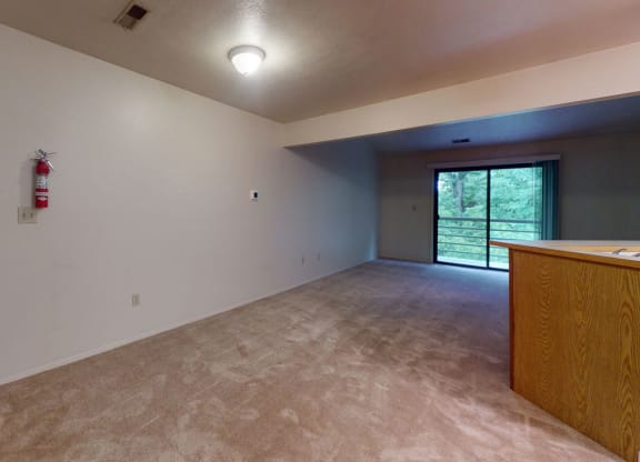 Living room leads to private balcony at Indian Lakes Apartments, Mishawaka, 46545
