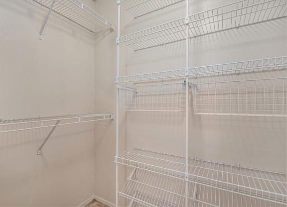 the walk in closet in the master bedroom has white wire shelves at Indian Lakes Apartments, Mishawaka