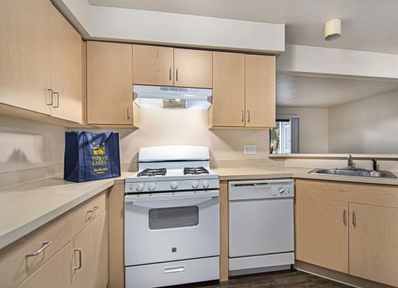 Kitchen with breakfast bar at Indian Lakes Apartments, Mishawaka, IN