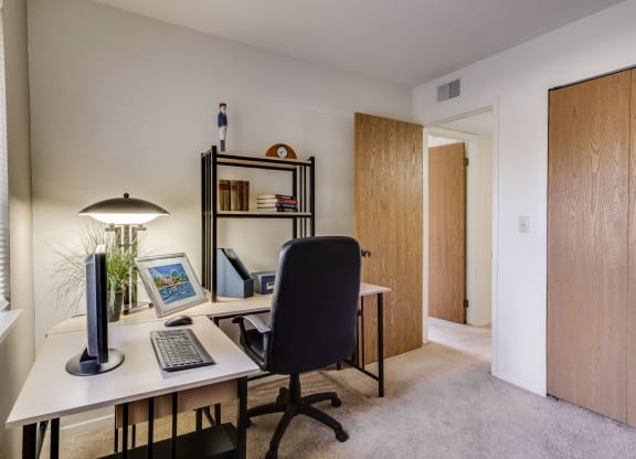 Bedroom or Den at The Village Apartments in Wixom, Michigan