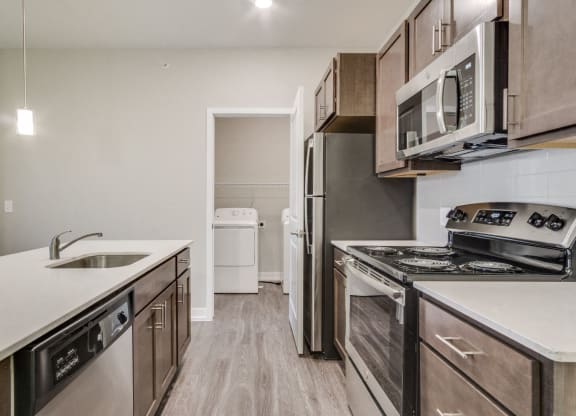 Kitchen and Full-Size Washer & Dryer (Spruce) at Village Place Apartments, Romeoville, 60446