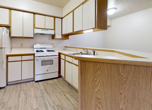 a kitchen with a breakfast bar at Irish Hills Apartments, Indiana, 46614