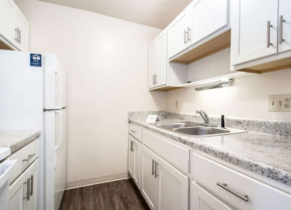 renovated kitchen with white cabinets at Irish Hills Apartments, South Bend