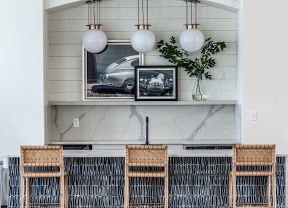 a bartop with chairs at Latitudes Apartments, Indiana, 46237