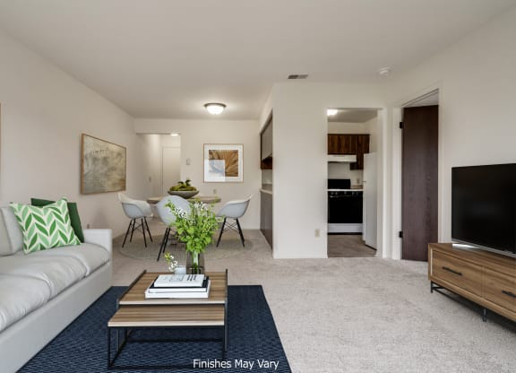 a living room with a couch and a coffee table at The Landings Apartments, Westland, MI, 48185