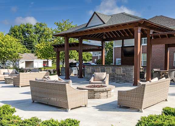 a patio with couches and a pavilion with a fire pit at Latitudes Apartments, Indianapolis, IN