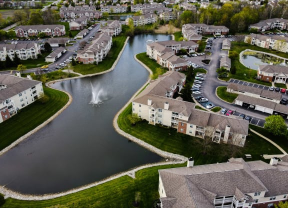 arial view of a subdivision with a lake and fountain at Latitudes Apartments, Indianapolis, IN