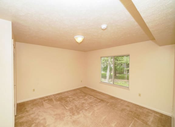 Second bedroom with a large window at Liberty Mills Apartments, Fort Wayne