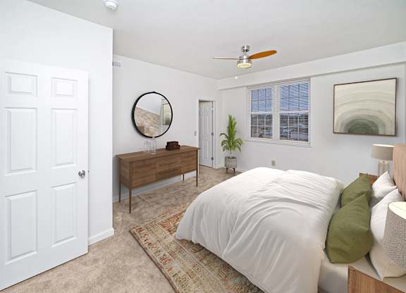 a bedroom with a large window and walk in closet at Limestone Creek Apartment Homes, Madison, AL